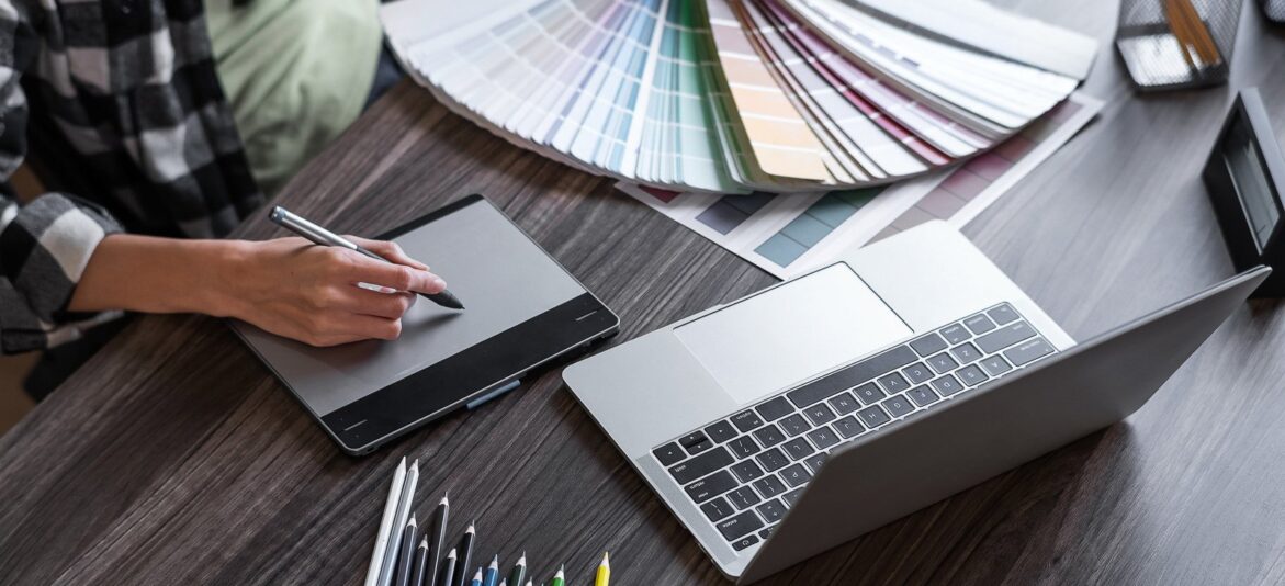 canva-graphic-designer-working-with-sketching-logo-design-at-office.-MAFlORJPrvQ